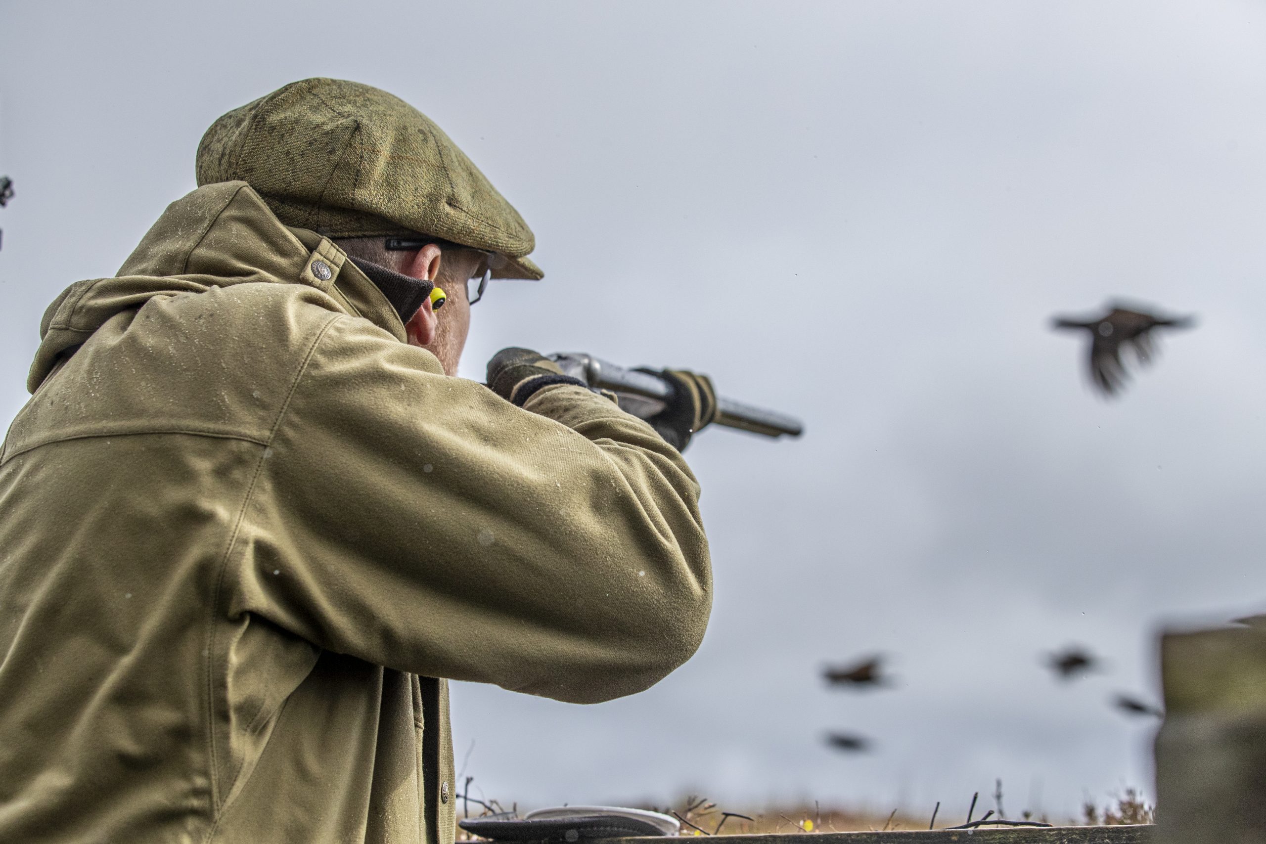 Man shooting grouse