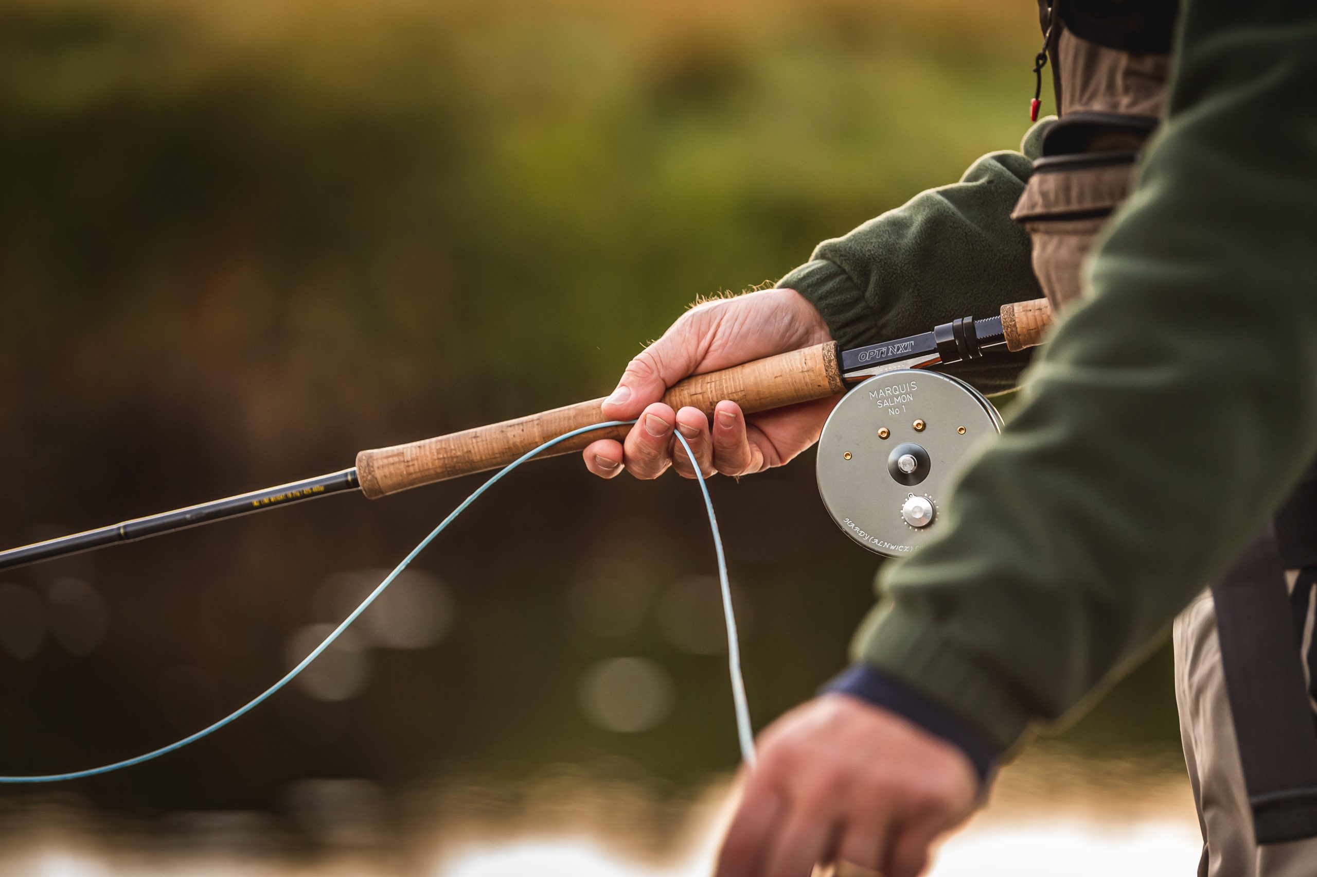 Man stood with a fishing rod in his hand