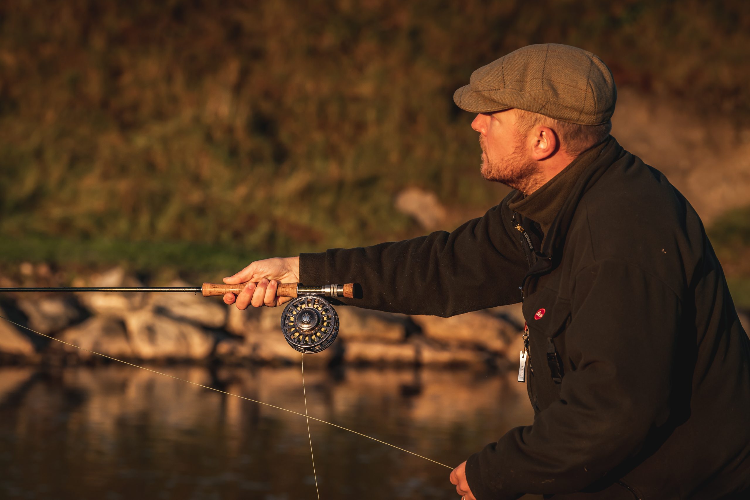 A man fishing on a river