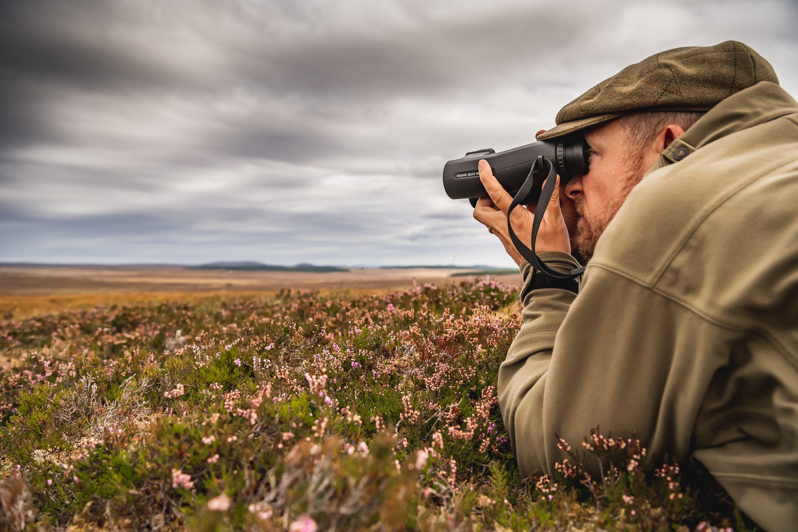 Man looking through binoculars