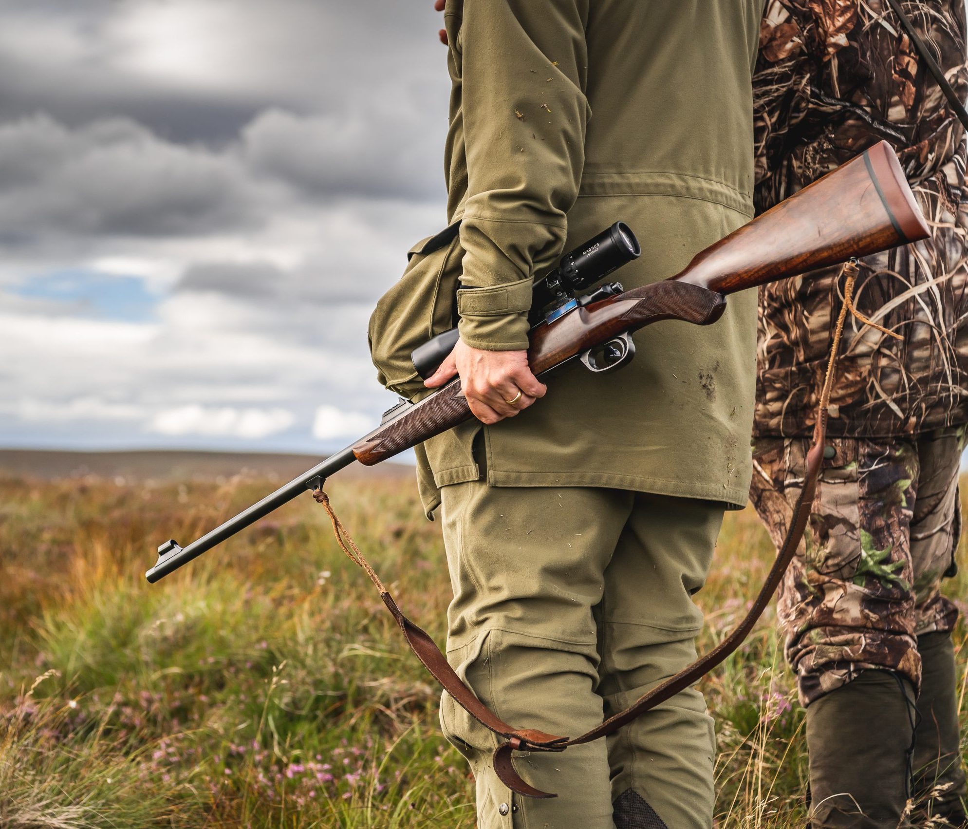 Man carrying a rifle