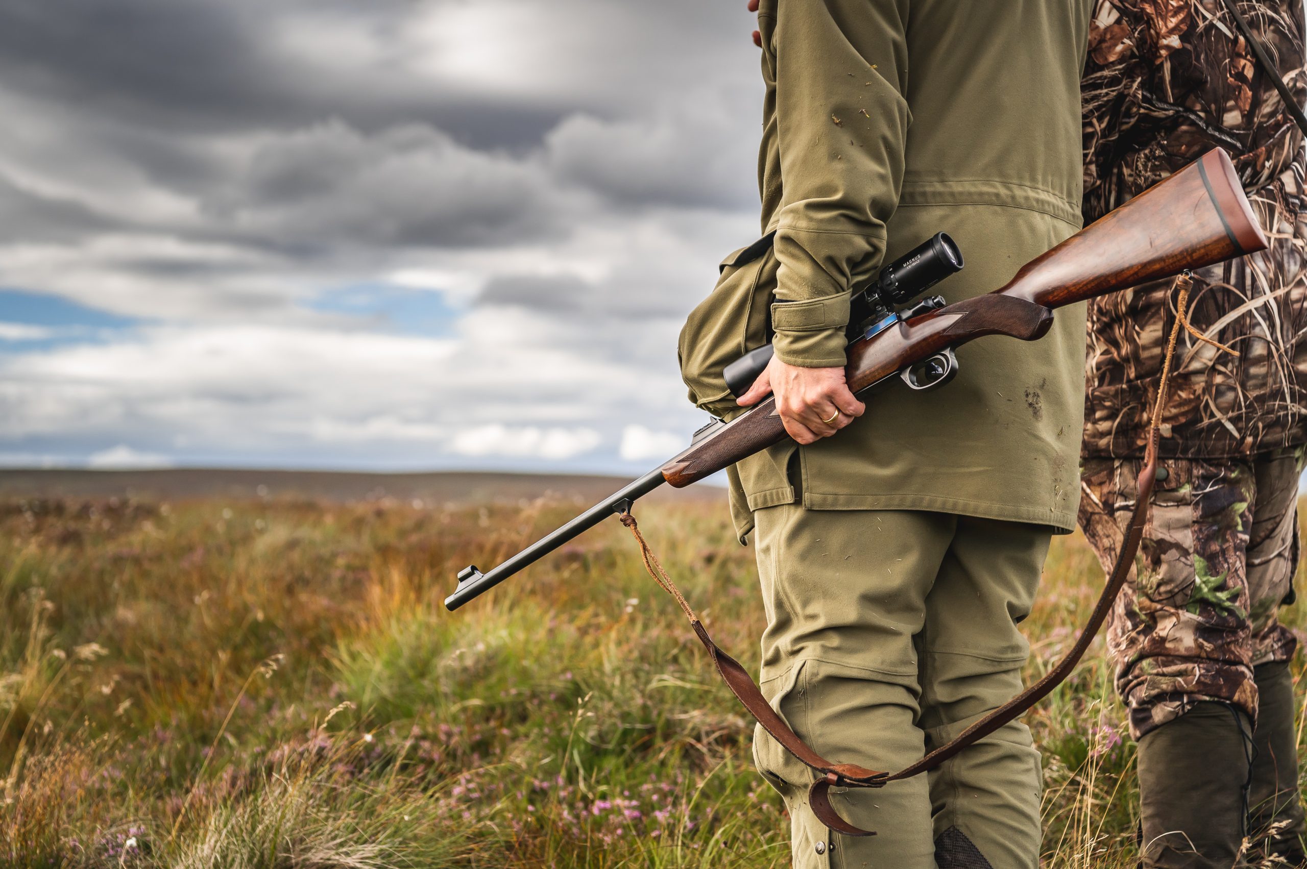 Man carrying a rifle