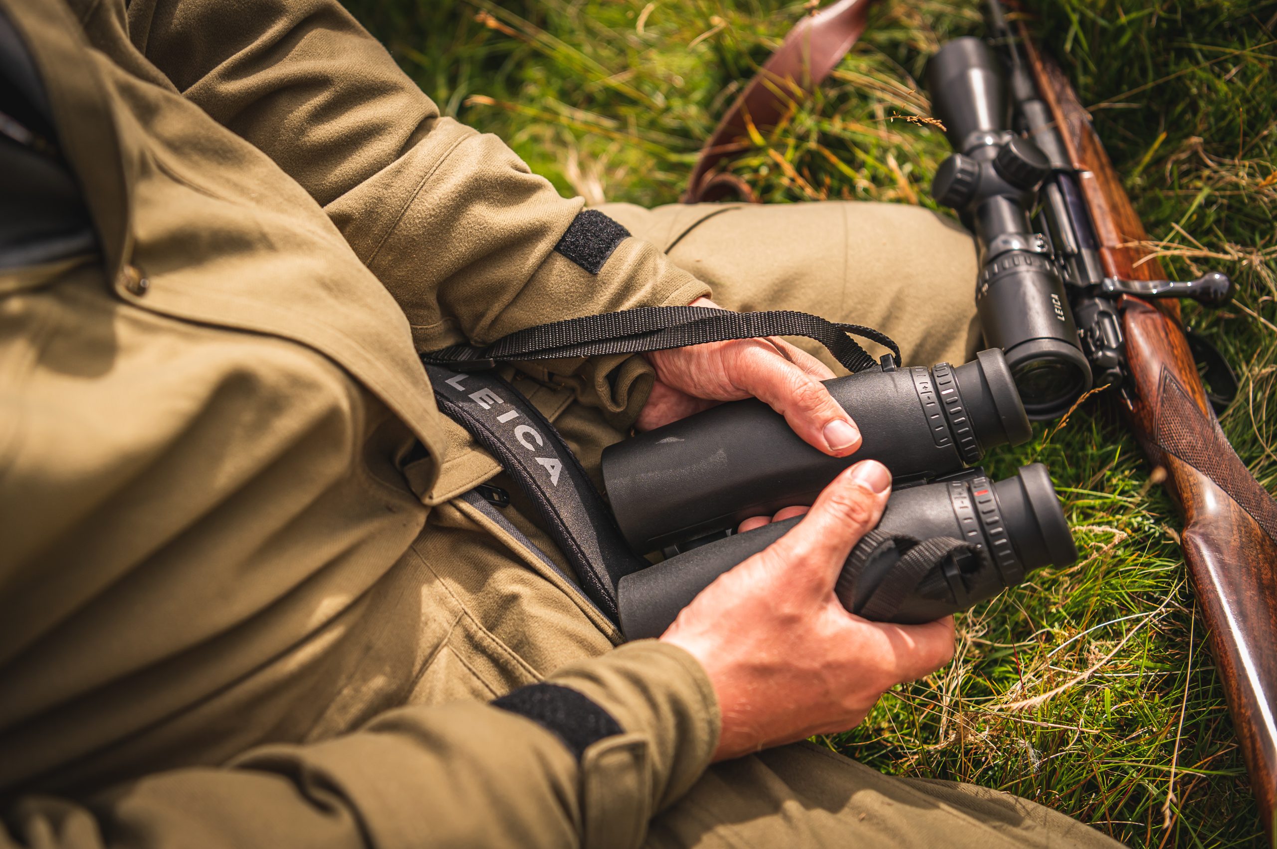 Man holding binoculars in his lap