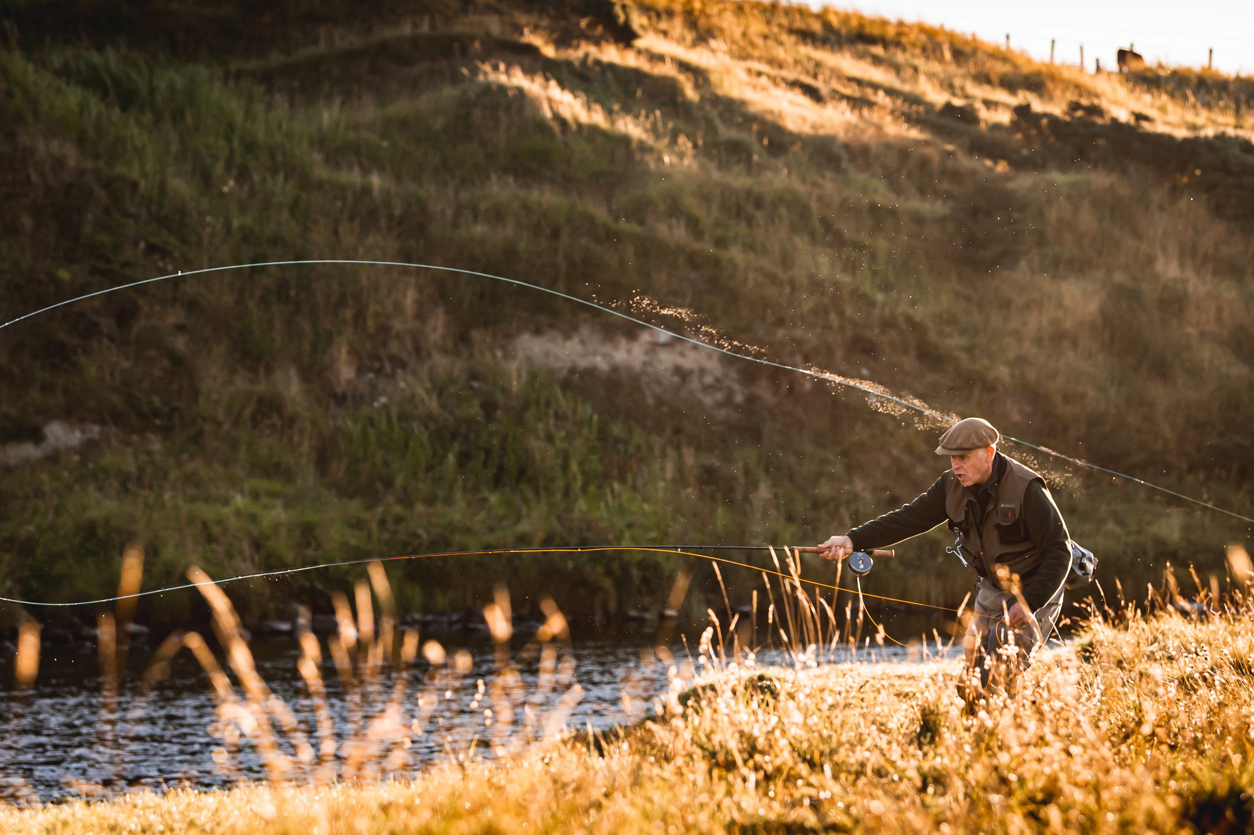 Man stood casting a line