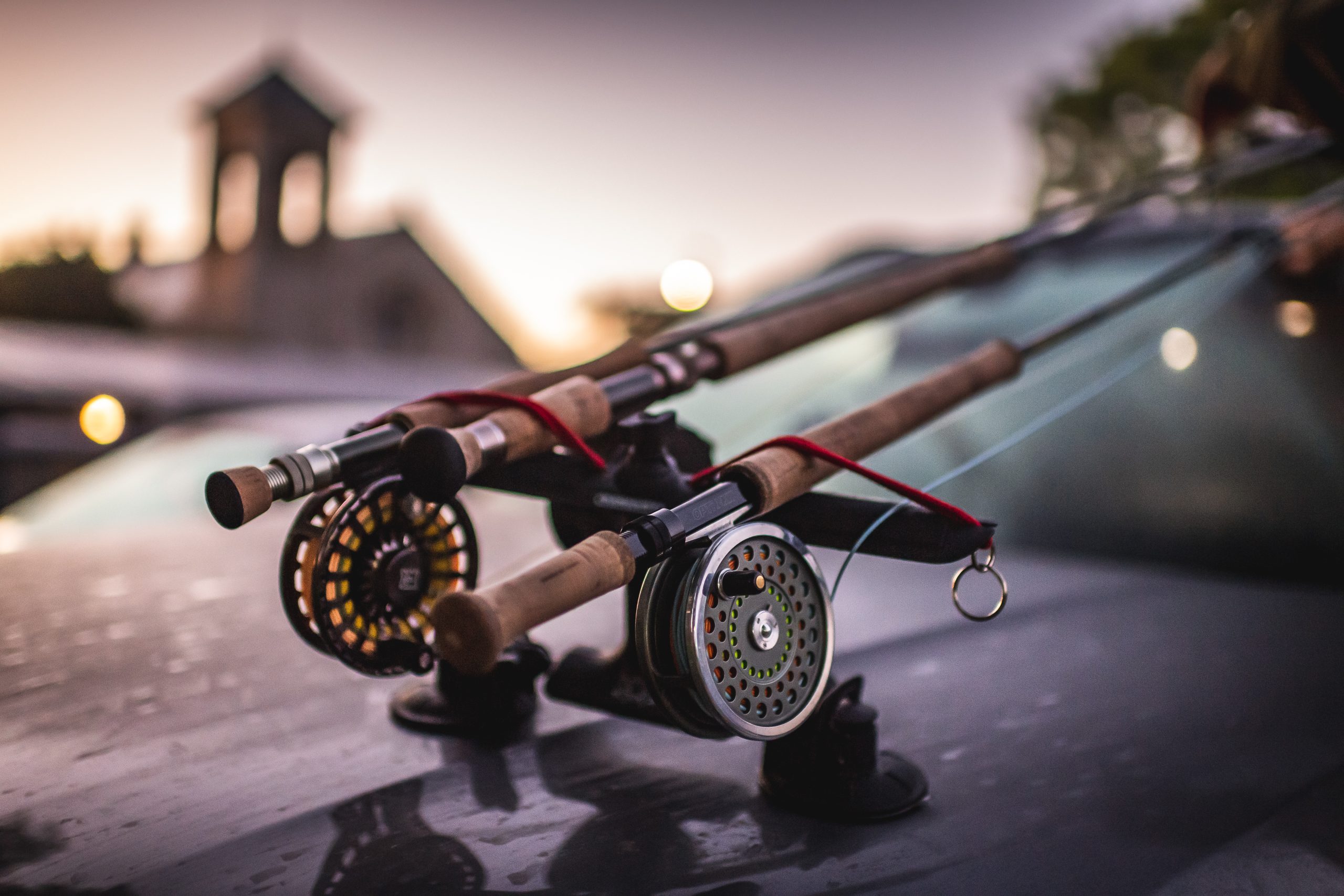 Two rods sitting on the bonnet of a 4x4