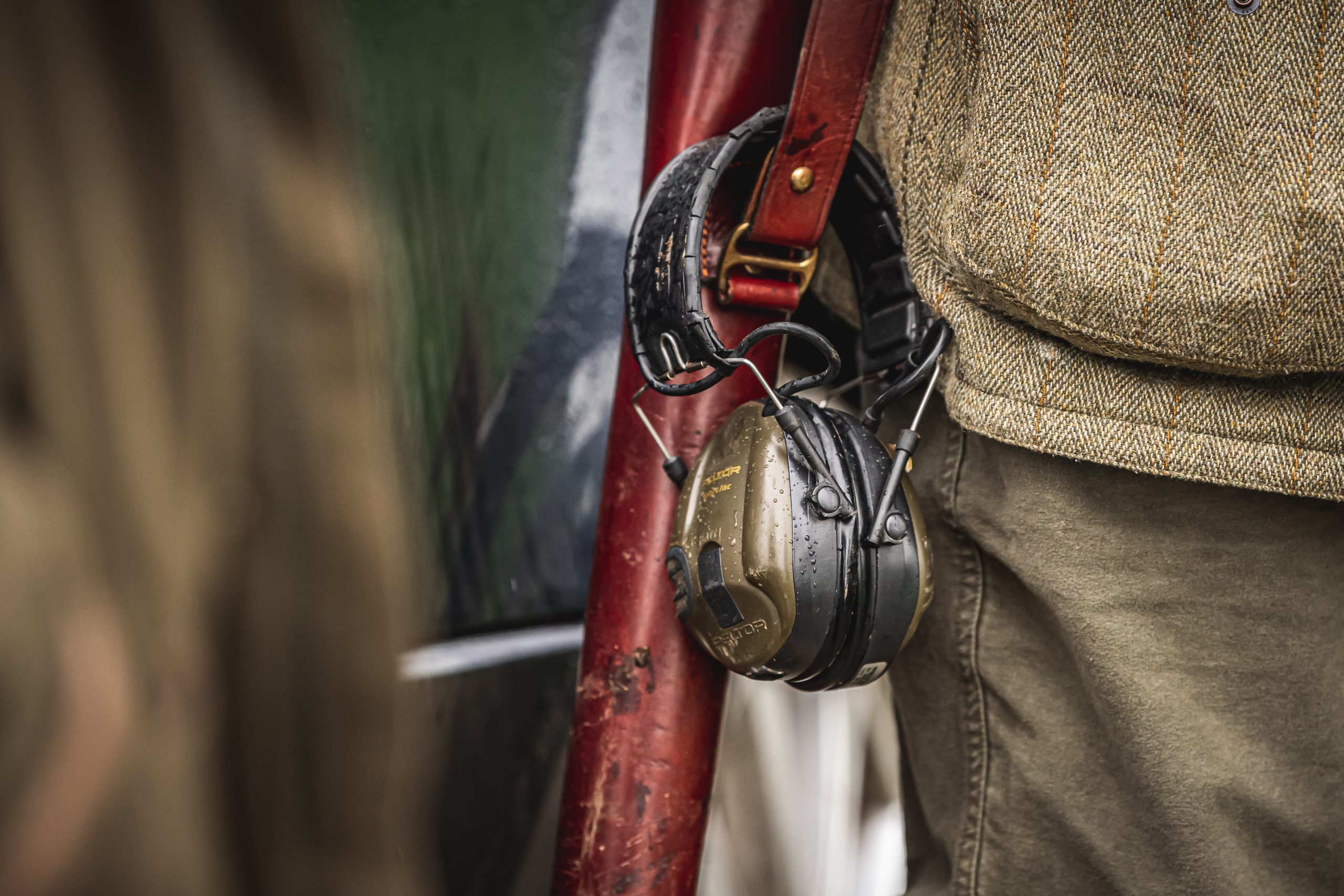 Ear defenders attached to gun slip