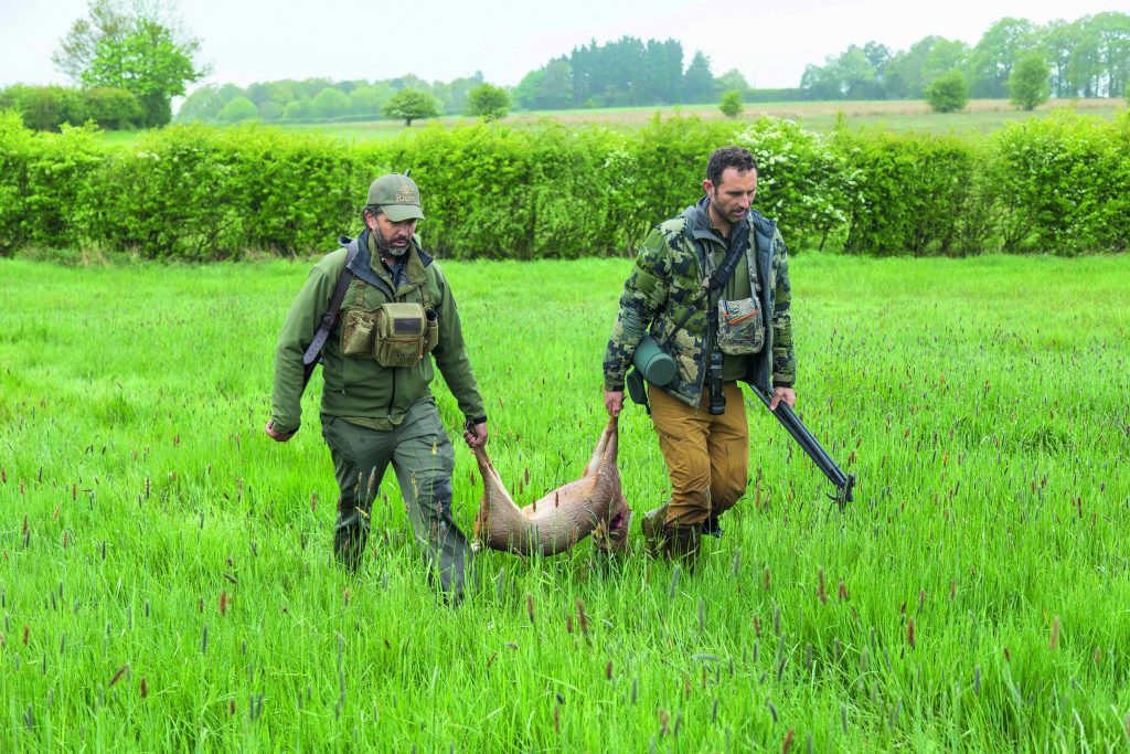Don Trump Jnr carries out his shot roe deer with his stalking guide