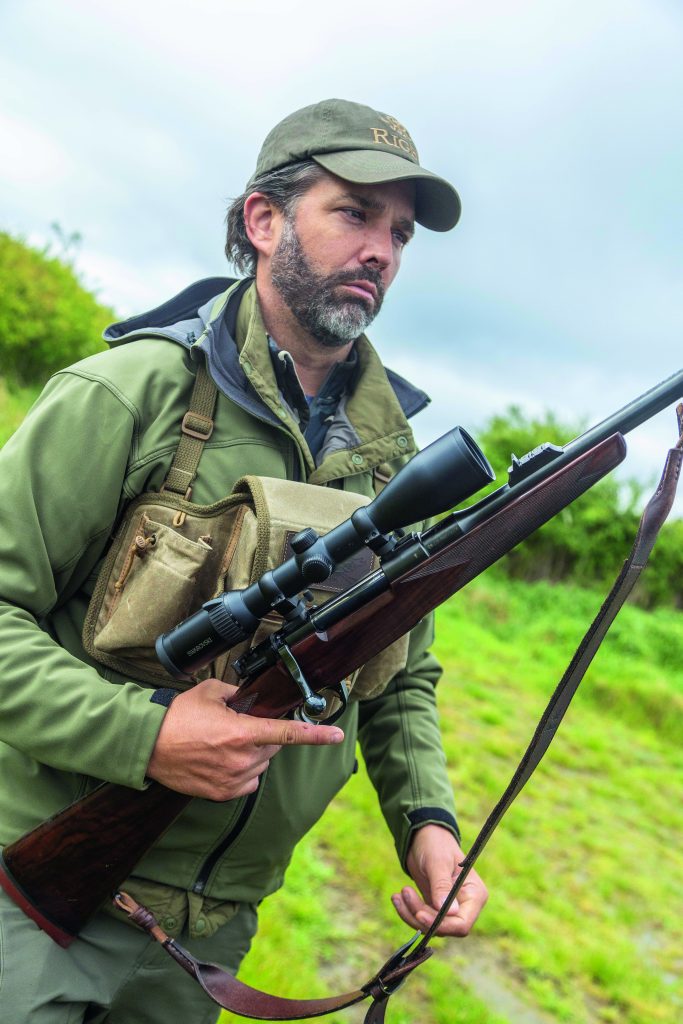 Don Trump Jnr holds his Rigby Highland Stalker rifle
