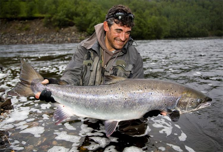 Matt Harris holding salmon in River Alta
